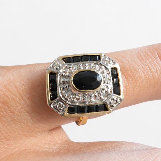 Ring worn on hand with soft white background